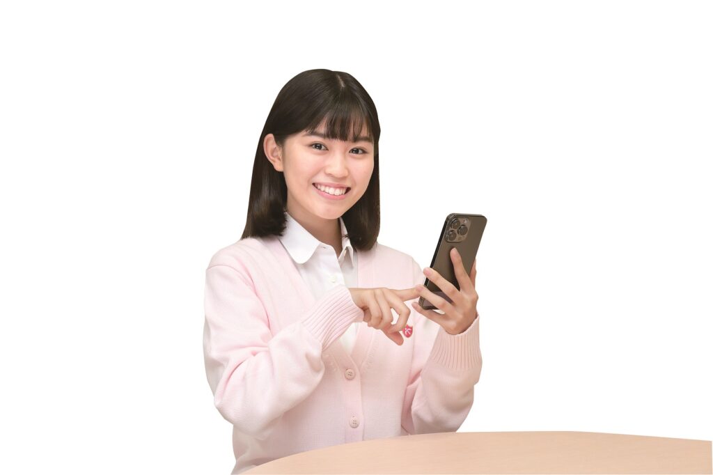 スマホを使う女子高生